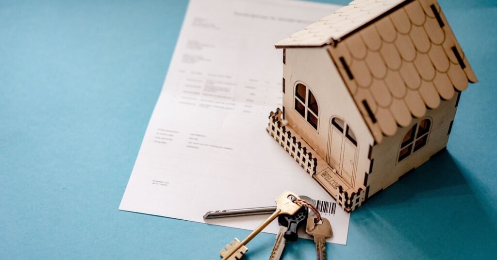 Property law documents with house model and keys