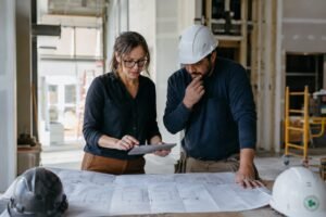 Commercial interior designer coordinating a fit-out on-site with a contractor