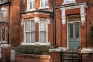 Victorian brickwork and bay window detail representing the architecture of the Dua Lipa house