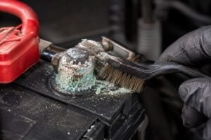 leaning corroded generator battery terminals with a wire brush